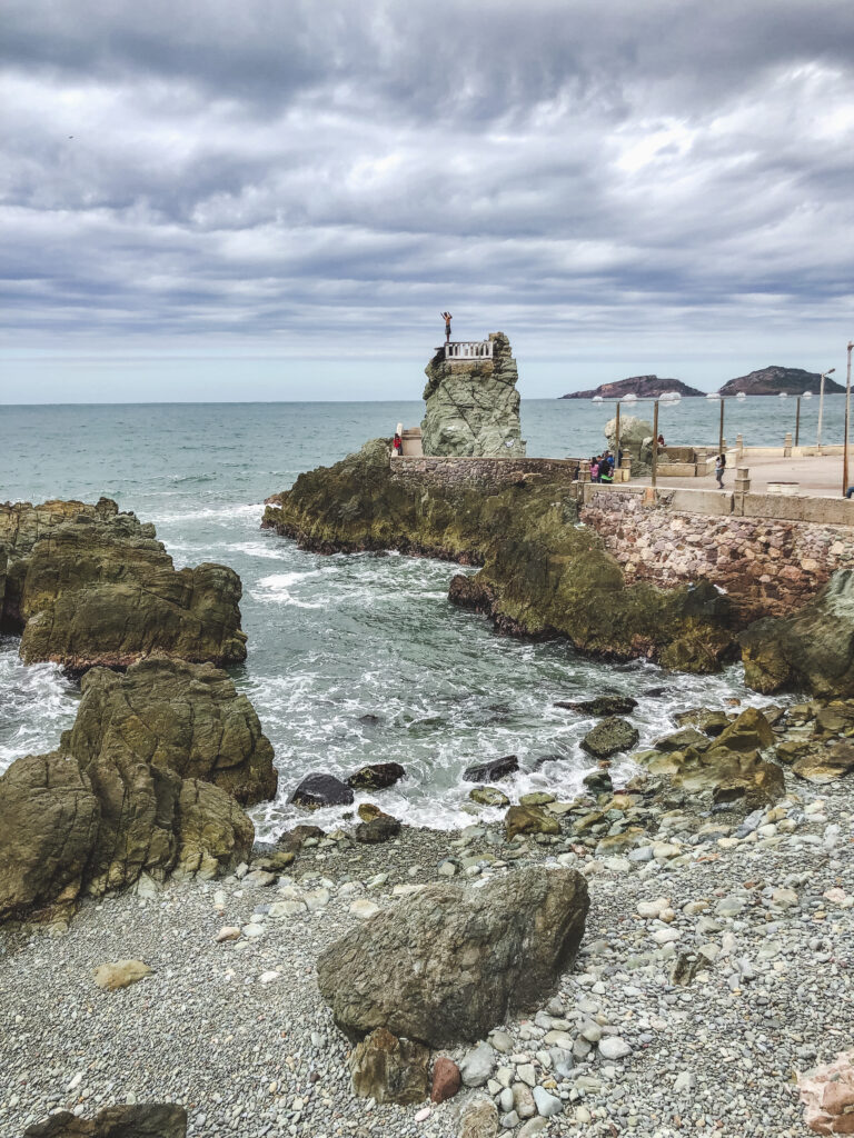 The El Clavadista cliff divers show off their skills to crowds of tourists