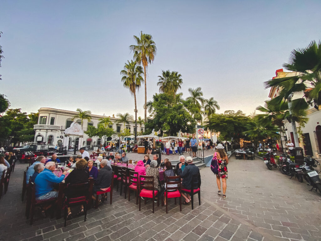 A plaza full of music, people, restaurants, and colours!