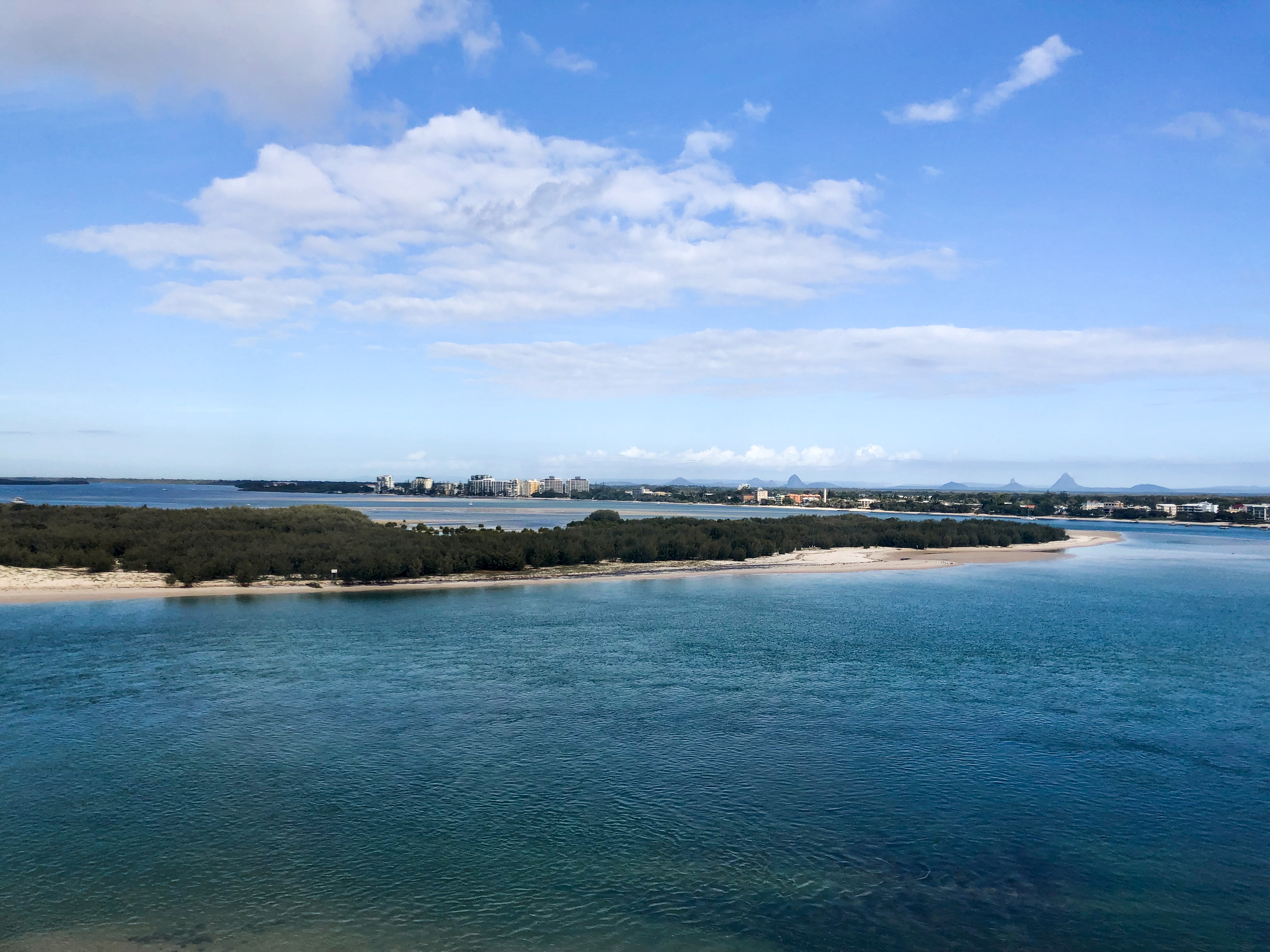 View of Bribie Island from Caloundra with the Glass House Mountains in the distance