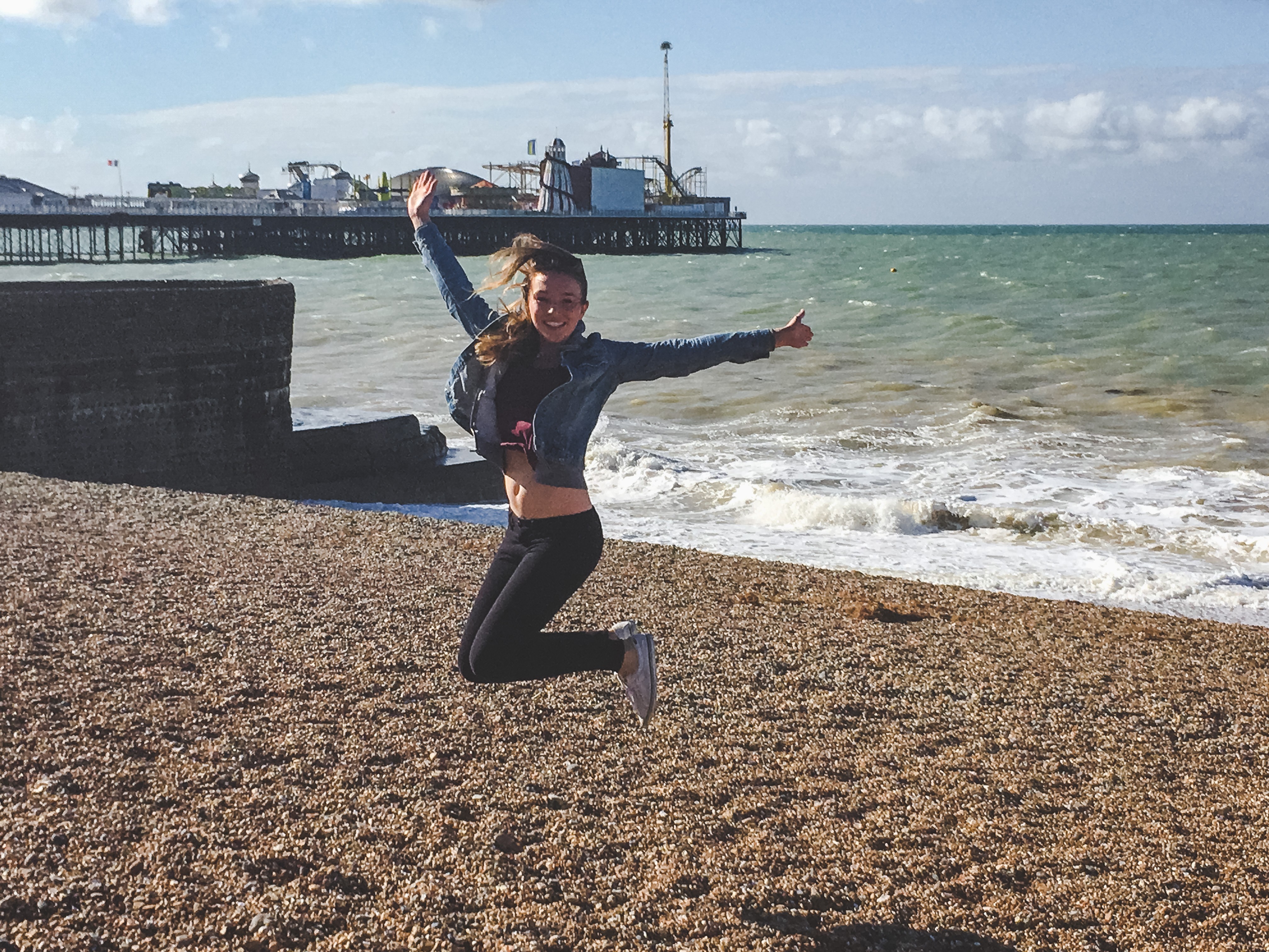 Enjoying beach time by the pier in Brighton, England